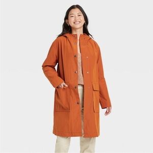 A new day water resistant coat with hood and patch pockets